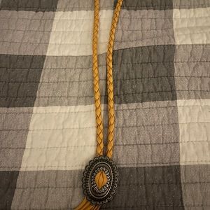 Deerskin braided concho necklace 
Mustard color